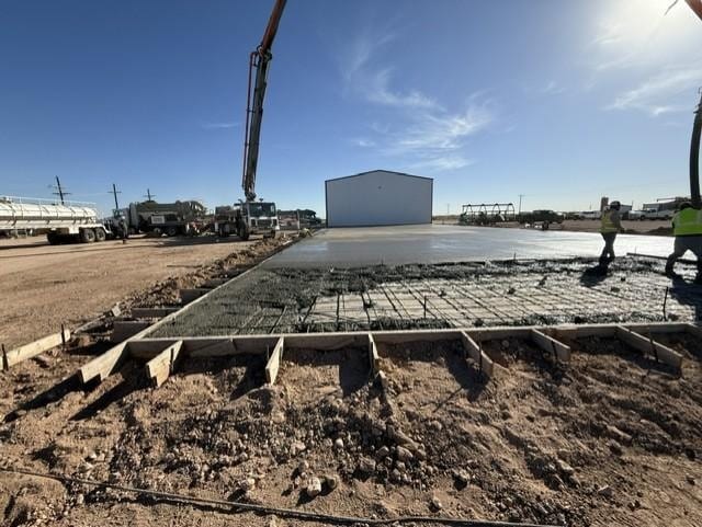 Gunite concrete being sprayed on a construction wall