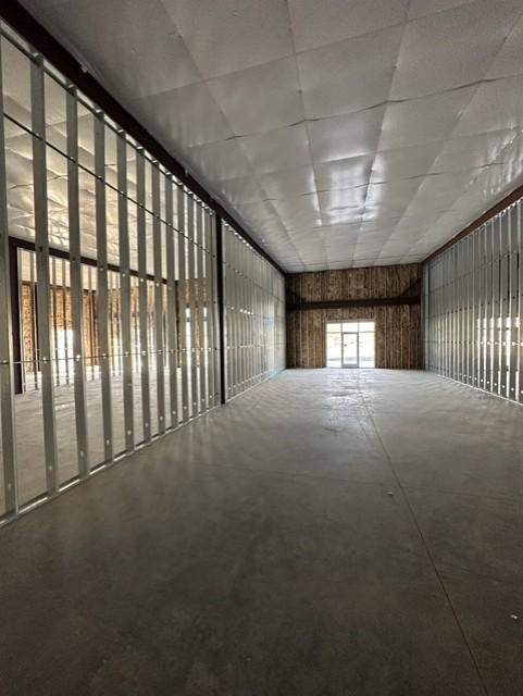 Interior metal stud framing and insulated ceiling panel construction