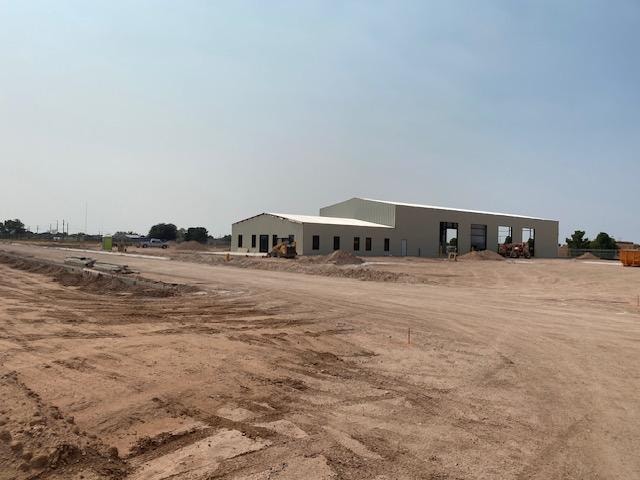 Wide exterior shot of completed commercial building