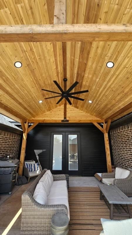 Covered outdoor patio addition with cedar ceiling and custom framing